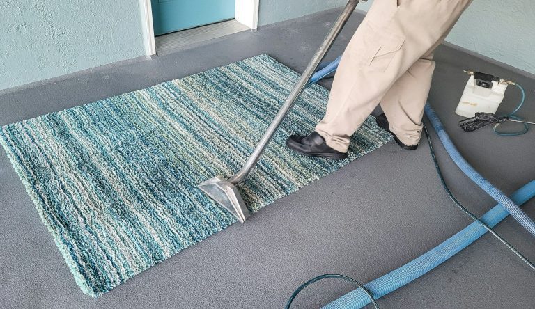 Man has small business cleaning carpets by shampooing and then steam cleaning.