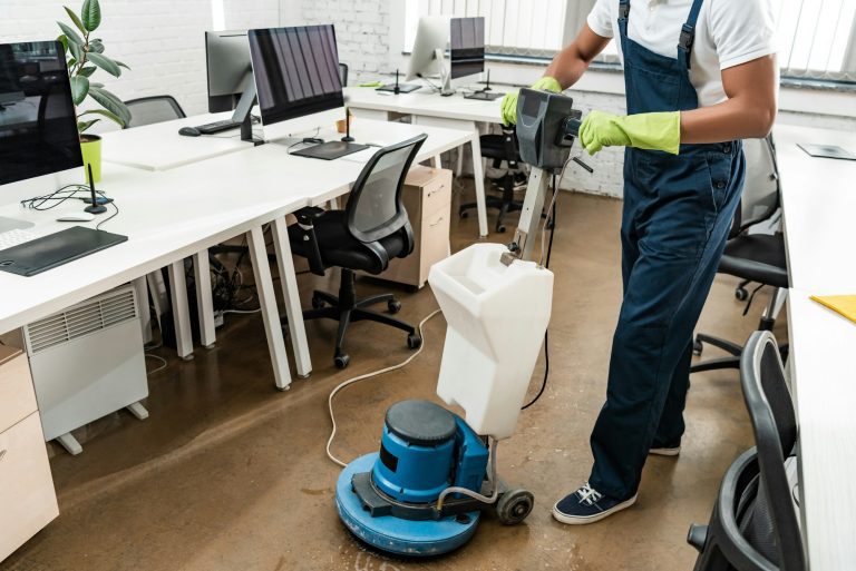 Best Home & Business Carpet, Upholstery and Tile Cleaning in Dublin, San Ramon & Pleasanton | partial view of african amercan cleaner washing floor with cleaning machine