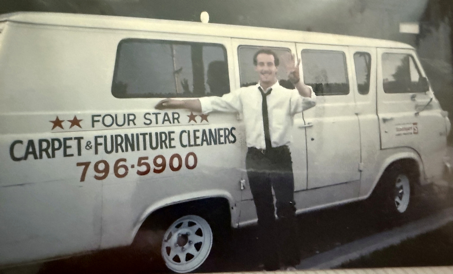 Cary Adler in front of Four Star Carpet & Furniture Cleaners truck